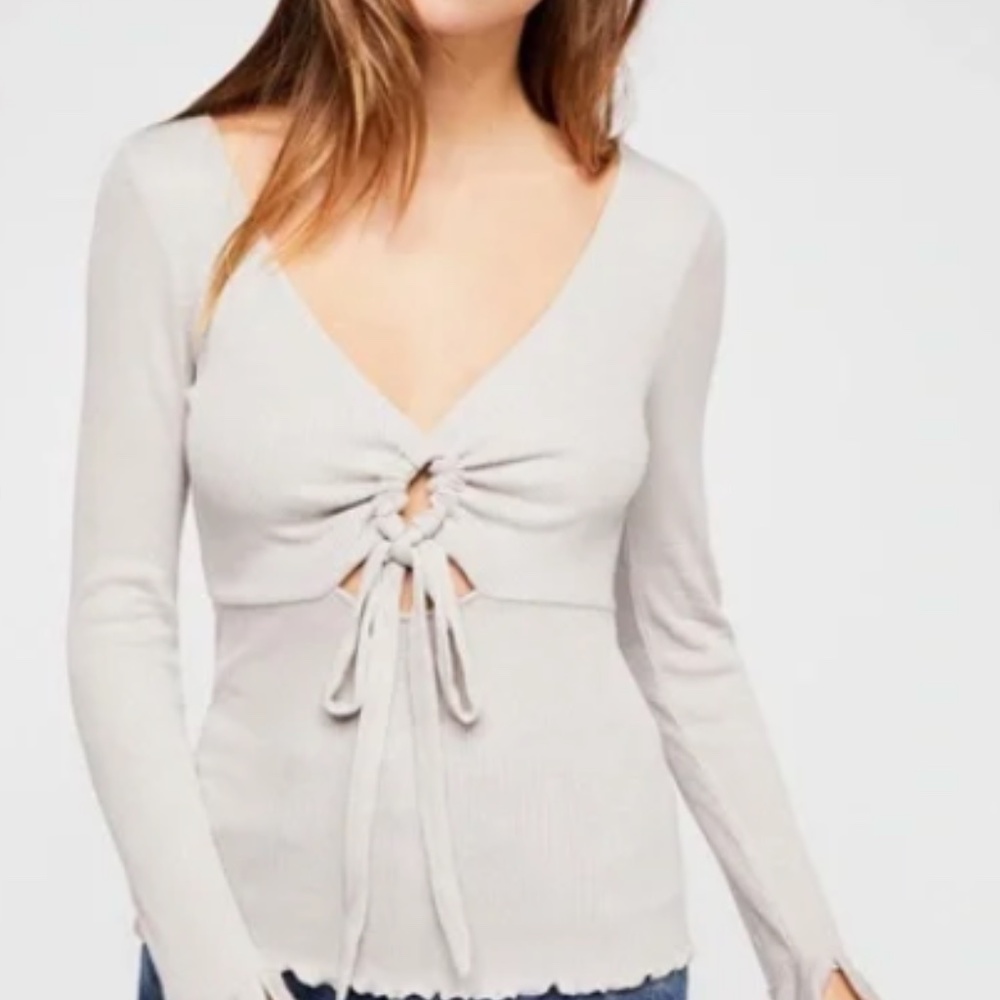 Free people cream v-neck long sleeve blouse with ruffled detailing + hole design